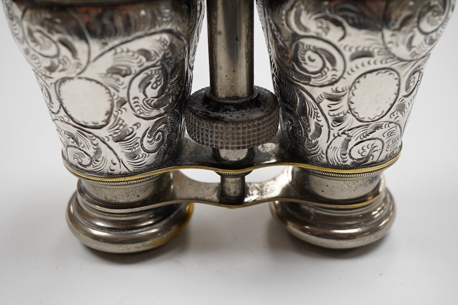 A pair of late Victorian repousse silver mounted plated brass opera glasses, Henry Charles Kelly, Birmingham, 1900, 8.8cm by 11.6cm.